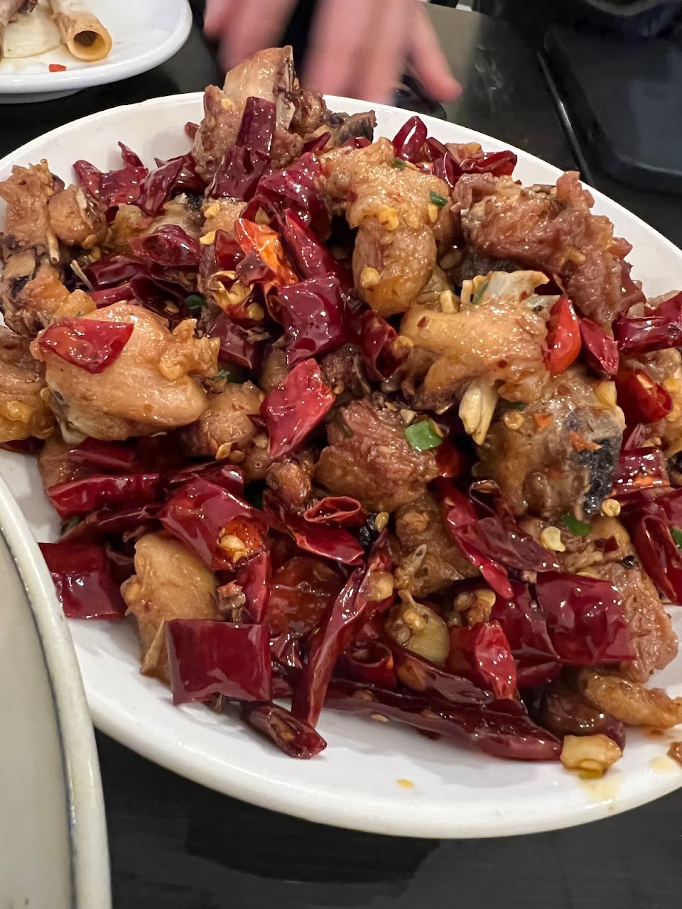 Dry chilli chicken dish with red chillies at Spice Paradise