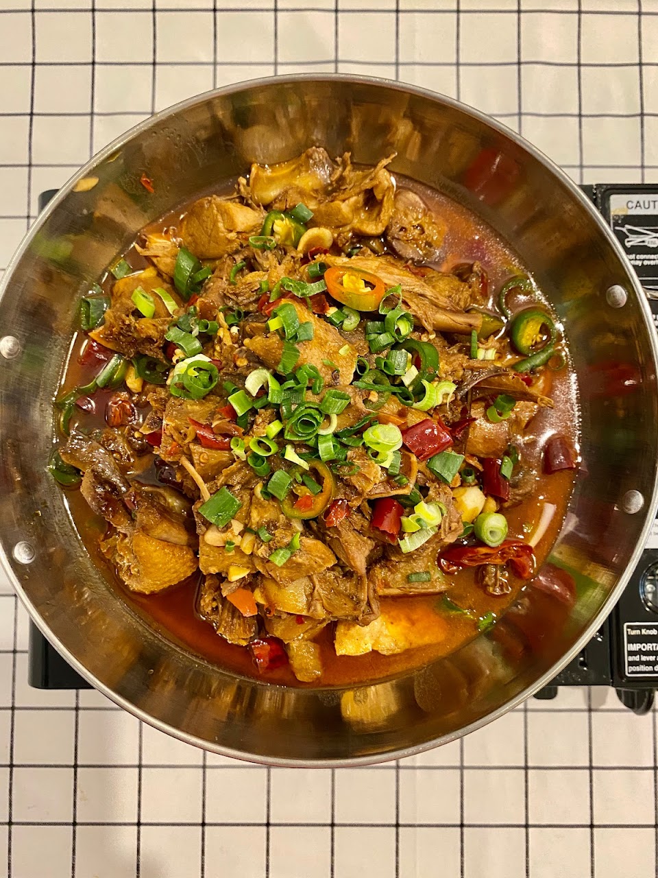 Overhead bowl of chilli-rich Hunan stew at Spice Paradise