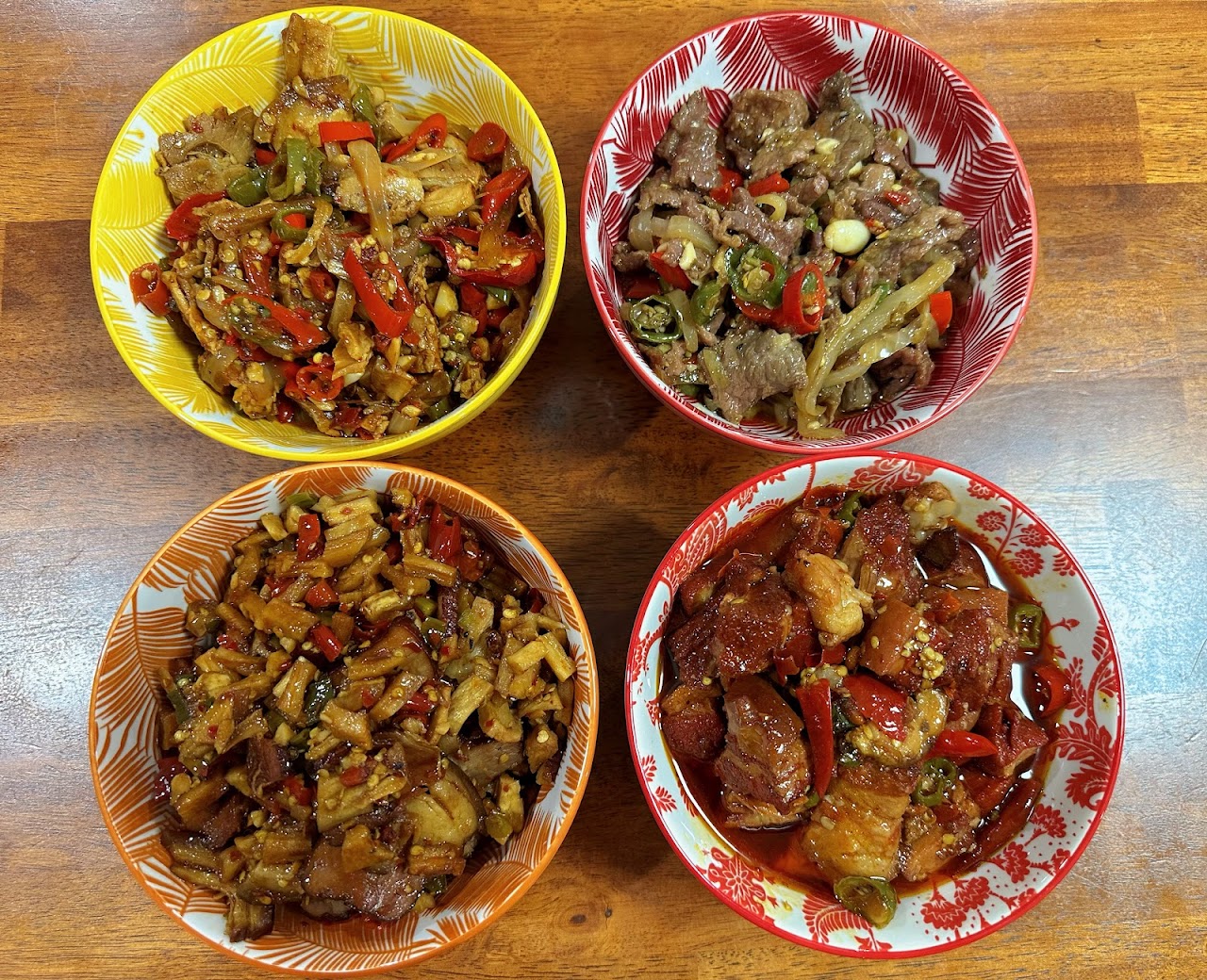 Four colourful Hunan dishes served together at Spice Paradise