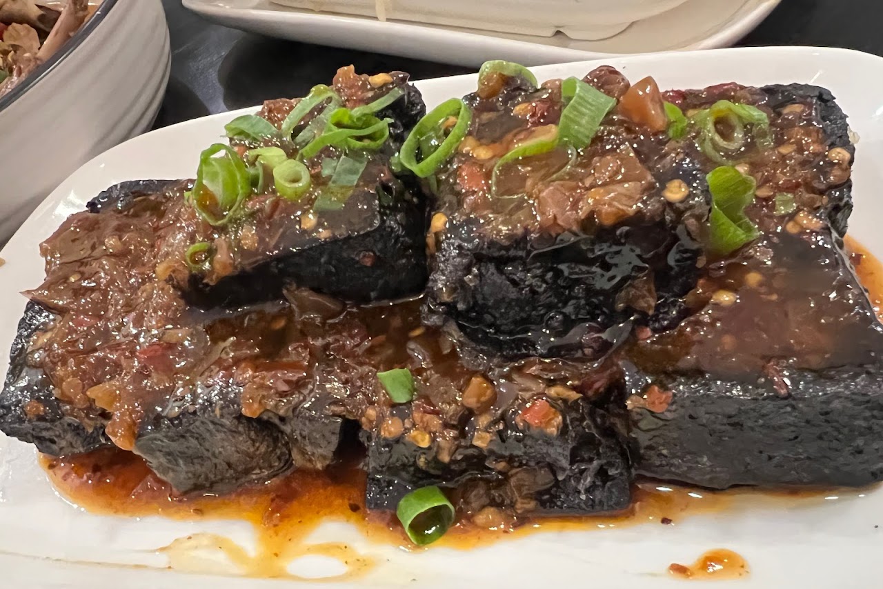Glazed ribs and dark sauce at Spice Paradise